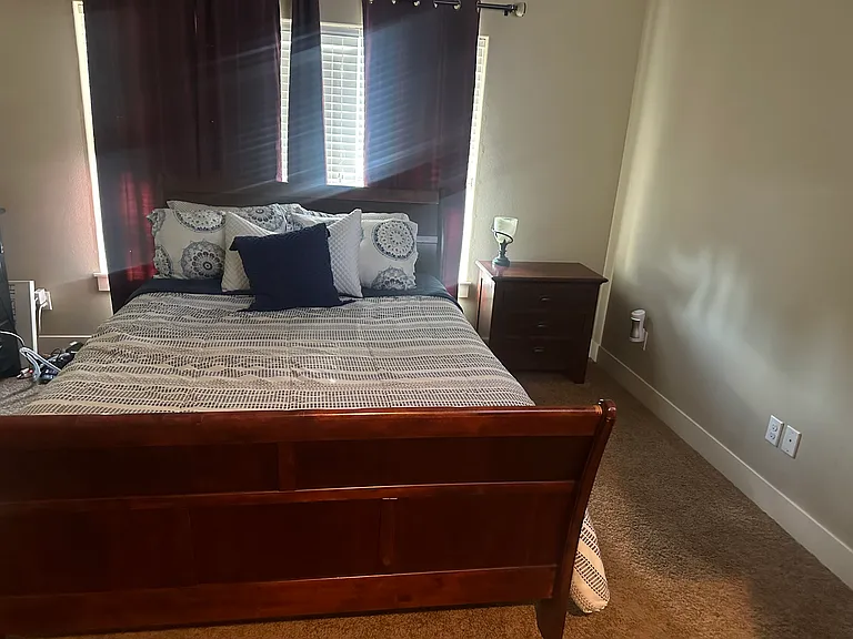 Furnished bedroom with a window
