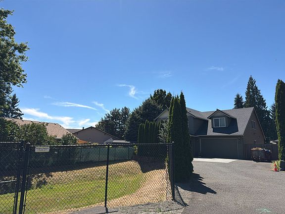 Driveway and fenced entrance to the home