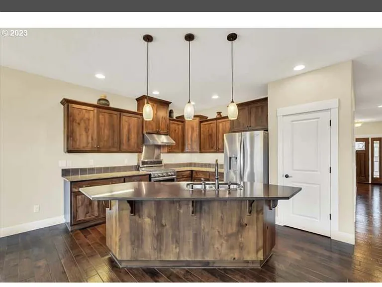 Kitchen with wooden cabinets and a central island
