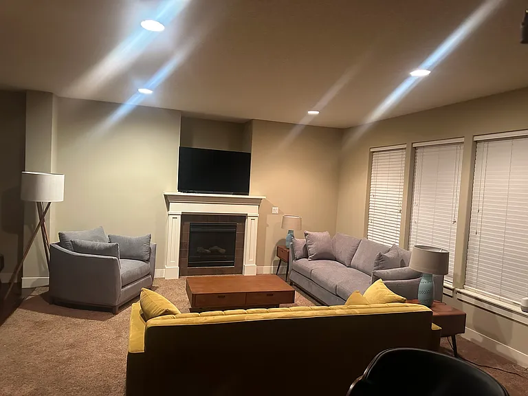 Furnished living room with seating and a fireplace